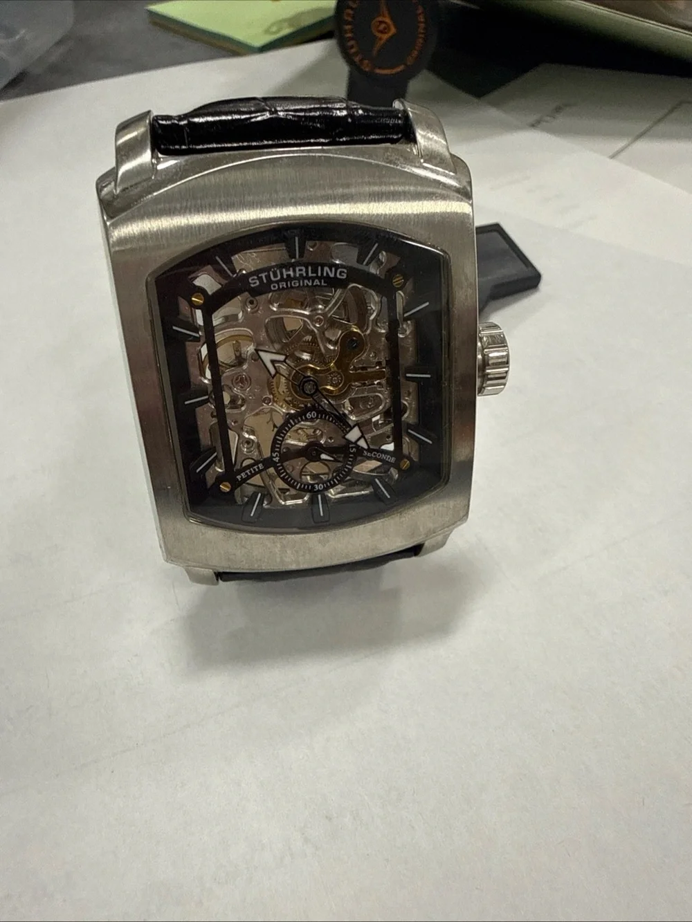 Stuhrling Original Silver Case Black Strap Skeleton Dial Watch with Gold Accents